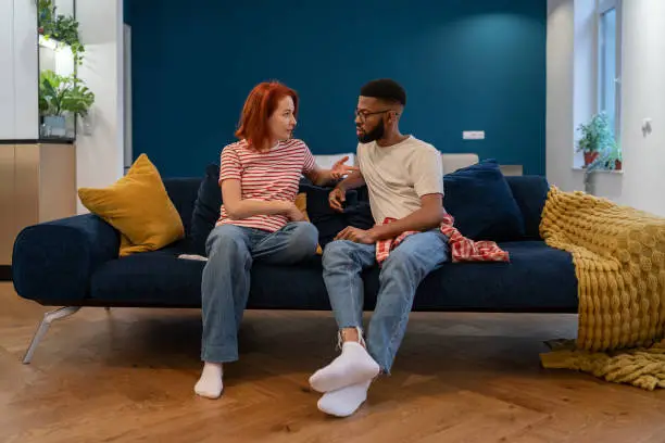 Couple discussing attachment styles in relationships at home