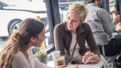 Parent and teen talking over coffee
