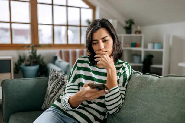 Love bombing warning signs with woman on phone