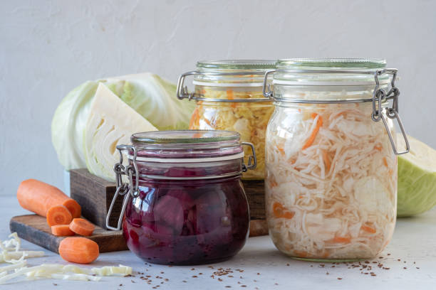 Probiotic supplement bottle with healthy foods to support gut health
